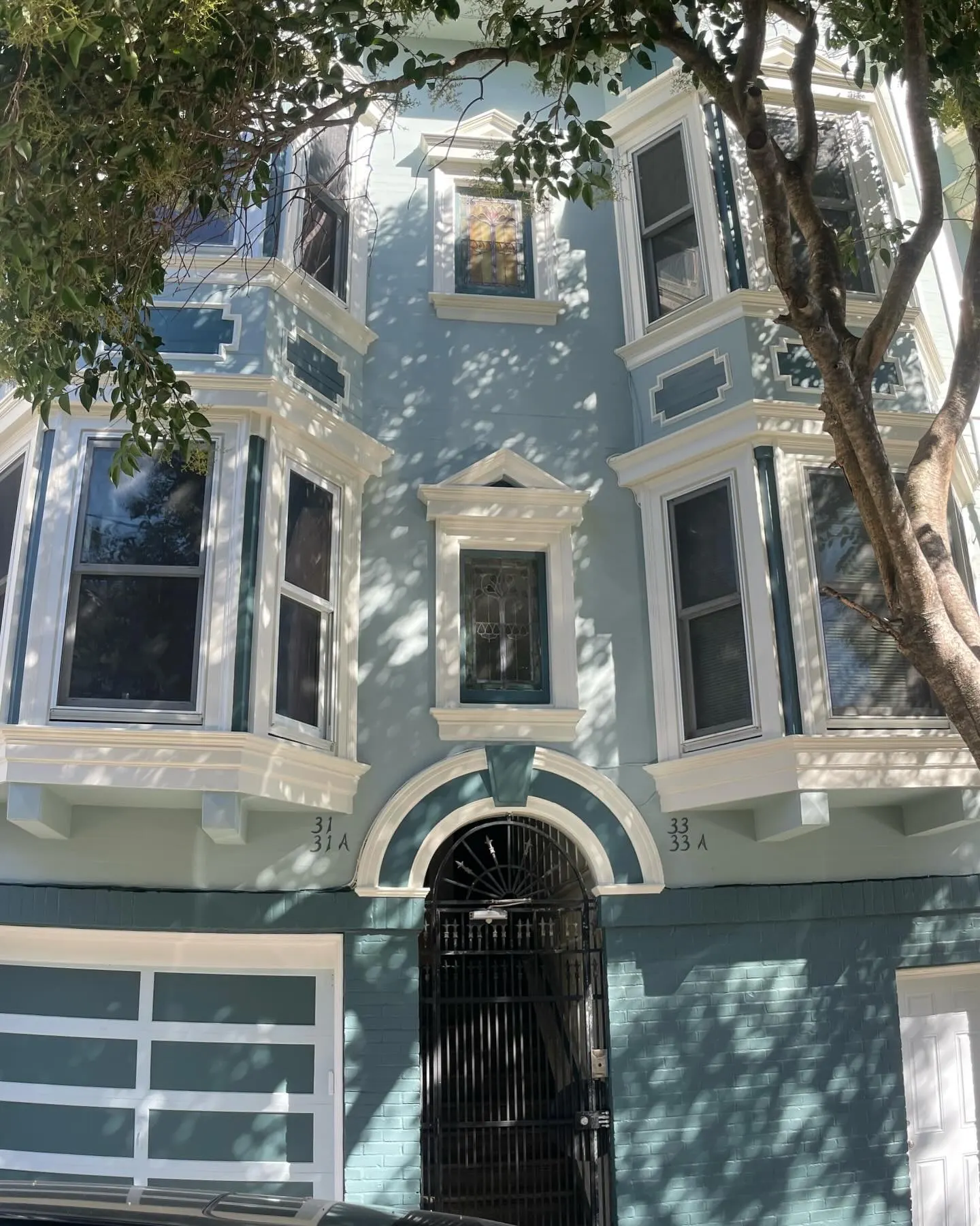 Close-up of the repainted bay windows and trim